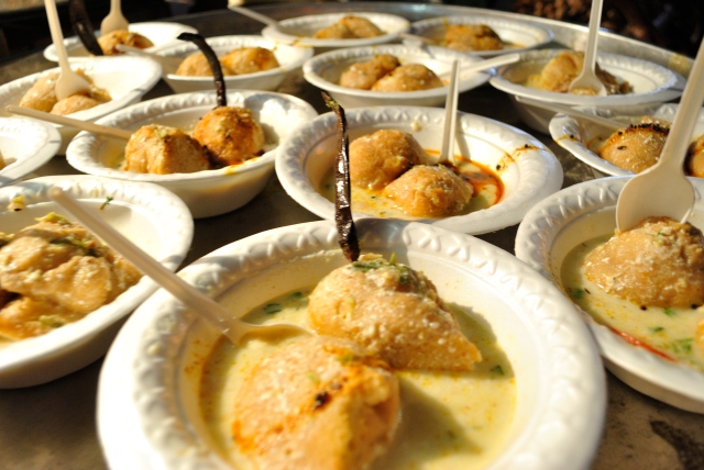 Dahi Vadas in all their splendour. Please do not miss the deep-fried chillies sticking upright as a garnish!